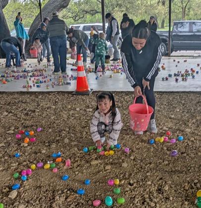 Kids picking up easter eggs