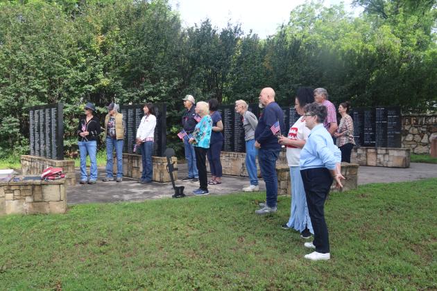 A crowd of people are drawn in for the Memorial Day ceremony