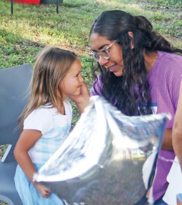 The community-led event included free hot dogs served by Rotary Club, a dessert potluck, face painting, games, live music by ENOK band and a screening of America-themed School House Rock cartoons.
