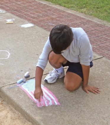 The community-led event included free hot dogs served by Rotary Club, a dessert potluck, face painting, games, live music by ENOK band and a screening of America-themed School House Rock cartoons.