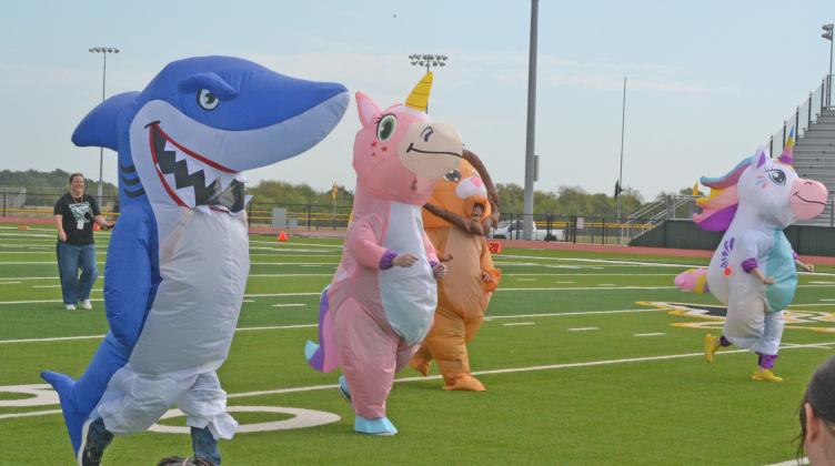 school administration donned mascot suits and raced for bragging rights. Cedric Ivie, the shark, won by a nose.