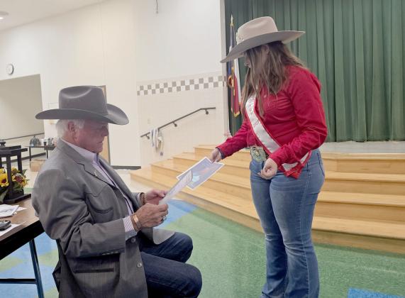 Ag Commissioner Sid Miller looks at specifications on a quarter horse up for bid at the Dublin Rodeo Heritage Museum fundraiser Saturday, Sept. 13. Miller was recently sworn into the museum's Living Legends Hall of Fame. Wyndi Veigel-Gaudette | Citizen staff photo