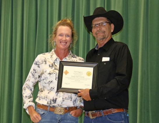 Casey Hammonds receives the Dublin Rodeo Heritage Museum Tom Rogers Journalism Award Saturday, Sept. 13 from museum organizer Rick Taylor. Wyndi Veigel-Gaudette | Citizen staff photo