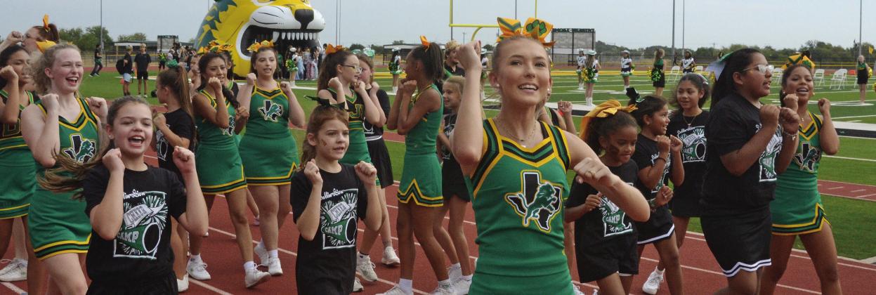 Dublin cheerleaders were joined by some spirited youngsters in the mini cheer camp at the Sept. 11 pep rally and game. Paul Gaudette | Citizen staff photo