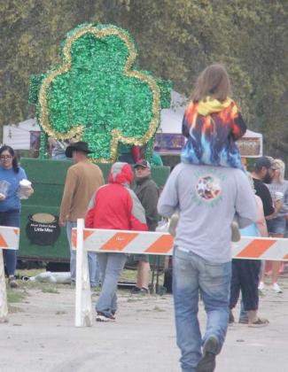 Festival-goers walk into the Solar Shamrock Festival scheduled as a St. Patrick’s Day redux Saturday, April 6. Paul Gaudette | Citizen staff photo