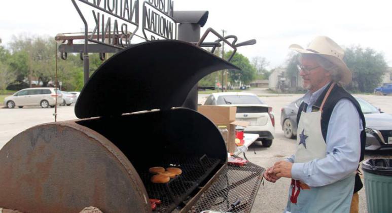 Members of the Dublin Chamber of Commerce board along with their families and volunteers organized the Solar Shamrock Festival held Saturday, April 6 in City Park. Below, Dublin Rodeo Museum hosted a cook out during the festival. Museum Manager Timothy Holden flips burgers. Paul Gaudette | Citizen staff photo