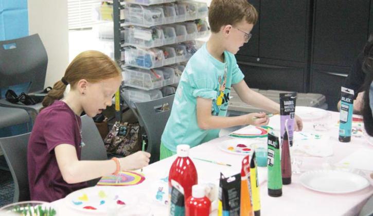 Kids of all ages participated in a rainbow craft at the Dublin Public Library Saturday hosted by Cross Timbers Fine Arts Council. The activity was modeled upon ‘I am a Rainbow’ by Dolly Parton, which is also featured on Dublin Public library’s storywalk. Participants also got to have snacks and did an additional rainbow crepe paper craft. Paul Gaudette | Citizen staff photo
