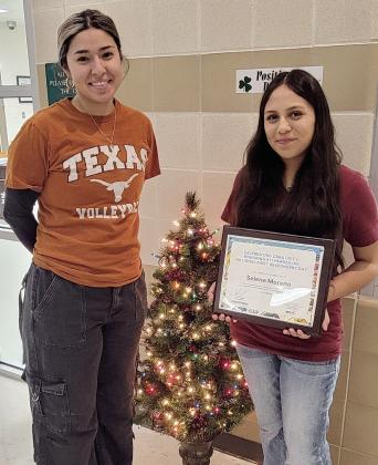 Art Teacher Skye Gaitan stands with 8th grader Selene Moreno who recently received first place out of 500 students in the 9-1-1 Heroes Art Contest, hosted by North Central Texas 9-1-1 and RapidDeploy. Courtesy photo