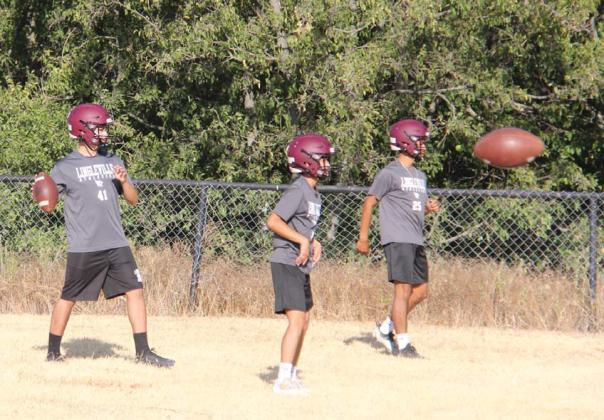 Paul Gaudette | Citizen staff photos Head Lingleville Football Coach Jim Bays (top right) and Assistant Coach Garrett Stewart led 2023 Cardinals in practice as two-a-days started Monday morning.