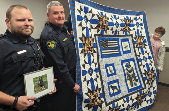 A quilt was presented to the Dublin Police Department in honor of Cindy, a former K-9 officer who died in 2023. Police Chief Cameron Ray and Sergeant Khris Jennings, who was Cindy’s partner, accepted the quilt. Paul Gaudette | Citizen staff photo