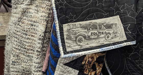 A sketch of a Dublin Police Car along with K-9 Officer Cindy is featured on a handmade quilt made by Peggy DeLaVergne, dedicated to the PD in honor of the K-9’s service. Paul Gaudette | Citizen staff photo