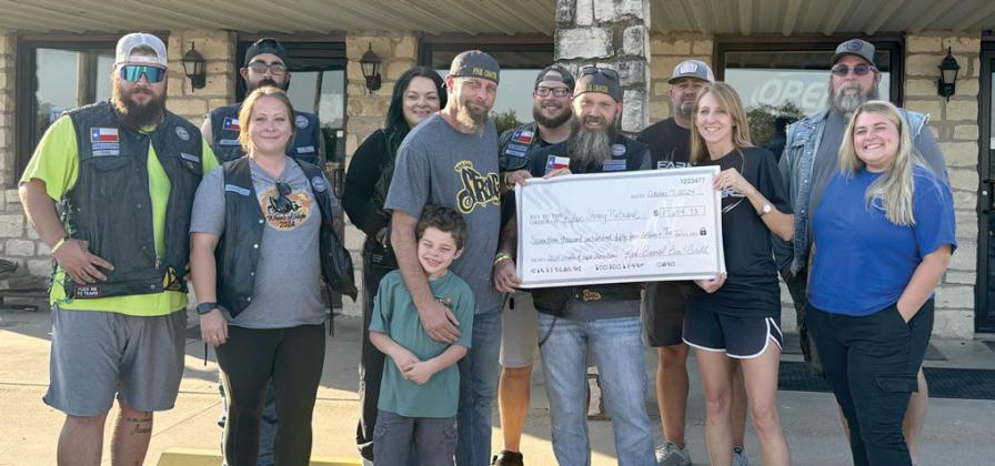 Staff at Red Barrel Bar and Grill present the Rylan Strong Network with a check for $17,654 from food and drink sales, silent auction and several generous donations and sponsors. The check made up a portion of the more than $58,000 raised through the third annual Wheels of Hope event for the Rylan Strong Network. Servant Souls MC was also on hand for the check presentation and aided in volunteering for the event. Courtesy photo