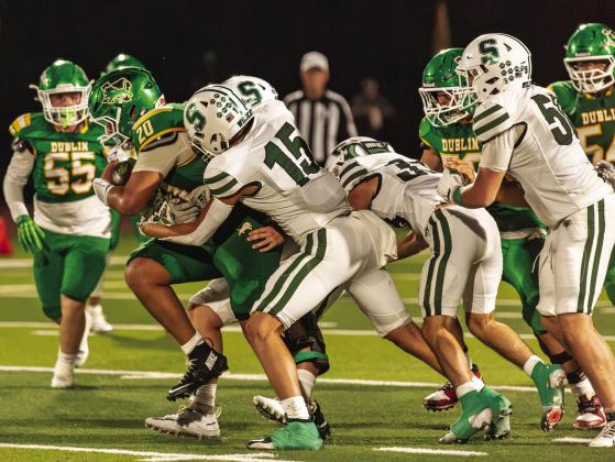 Dublin Lion Joe Salinas draws a string of Santo Wildcats as he moves to rush the ball up field in the Sept. 4 home game. Danielle Meador | Citizen staff photo