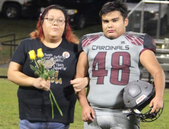 Paul Gaudette | Citizen staff photos Lingleville football and cross country seniors were escorted by friends and family across the field at halftime in the Nov. 8 home game for senior night.