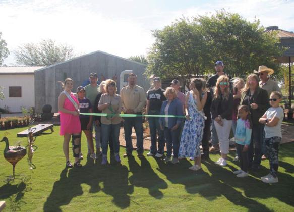 Texas Sage owners Paige and Scott Williams and Wes Allen along with friends, family and Dublin Chamber of Commerce board members gather for a ribbon cutting ceremony for the newly opened nursery, garden center and gift boutique Saturday, April 13. Wyndi Veigel-Gaudette | Citizen staff photo