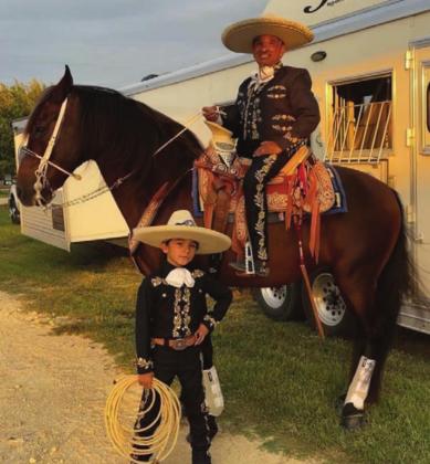 Whiplash the cowboy monkey (left) and Tomas Garcilazo and his son, Louie were among the many performers at the Oct. 25 Morning Star Ranch Gala in Hico. During the event, Sue Wiess, Nicole Petet and Carley Cary were recognized as the respective Board Member, Volunteer and Rider of the Year. Jena G Photography | Submitted photos