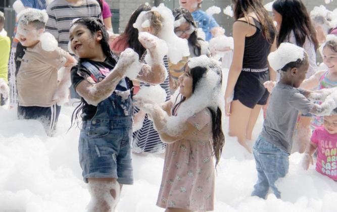 Sisters enjoy playing in a giant foam pile at the annual Back to School Fair at the Dublin Public Library Saturday, July 27. The event offered free backpacks, toiletries and more for students and parents getting ready for school. For more photos see page 8A and the Citizen Facebook page. Paul Gaudette | Citizen staff photo