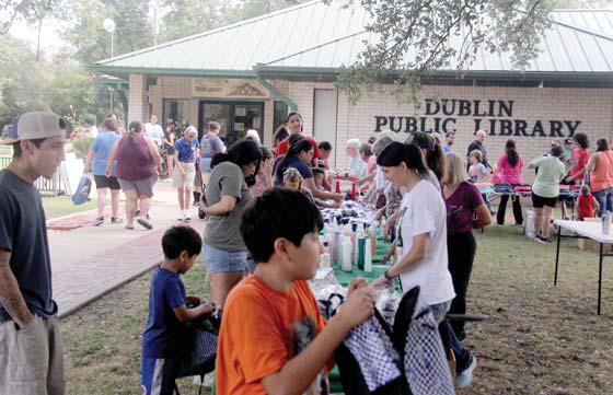 Paul Gaudette | Citizen staff photo Right, hundreds of people participated in this year’s Back to School Fair at the Dublin Public Library. Participants were able to get a free backpack or duffle, gather up toiletries, new socks and underwear and other free give-a-ways courtesy of local donors.