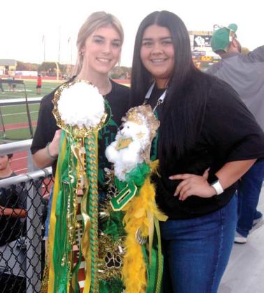 Wyndi Veigel | Citizen staff photo Libertie Turner and Chloe Cisneroz show off their homecoming mums at the football game Friday, Sept. 23 against the Florence Buffaloes.