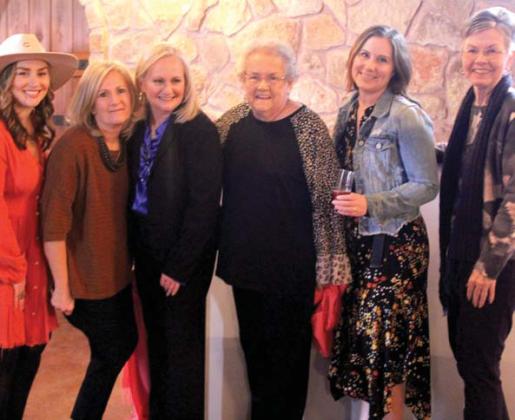 Cross Timbers Family Services Executive Director Laura Gambino pauses for a photo with friends. Wyndi Veigel | Citizen staff photo