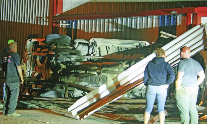 No injuries as rollover crashes through carport