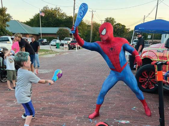 Submitted photo Paxton faces off against Spider-man at the inaugural Rylan Strong Network Car and Bike Show. The youngster is facing his own battle with cancer but he is currently stable with no positive growth!