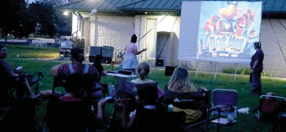 Crowds gather at the Dublin Public Library Friday, July 11 for an outdoor movie night featuring Dreamworks ‘Dog Man.’ The library provided free popcorn while Dublin Dairy Queen provided root beer floats. Paul Gaudette | Citizen staff photos
