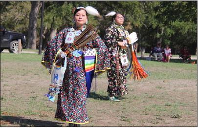Native American women dance to the beat of music while showcasing their outfits. Wyndi Veigel | Citizen staff photo