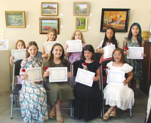 Wyndi Veigel-Gaudette | Citizen staff photo Erath gentlemen and ladies take turns practicing proper greetings in the Cross Timbers Fine Arts Council manners camp held July 21-July 25. Many local leaders joined instructors in helping them practice. Other lessons included proper table setting, social media etiquette, flower arranging, tying a neck tie, hat etiquette, getting out of a vehicle and all got to paint a vase to take home.