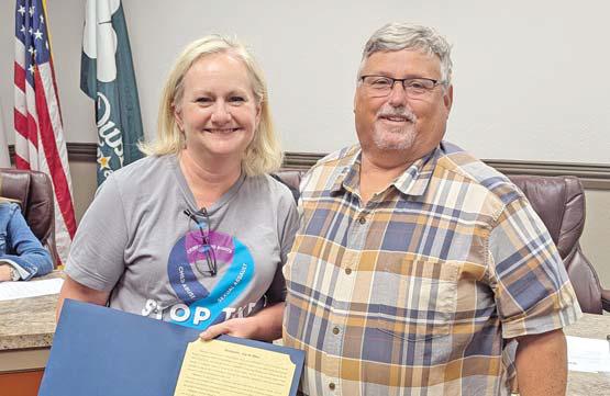 CTFS Executive Director Laura Gambino and Dublin Mayor David Leatherwood hold a proclamation signed in honor of Stop the Silence for National Crime Victims’ Rights Week, National Sexual Assault Awareness Month and National Child Abuse Prevention Month. Paul Gaudette | Citizen staff photo