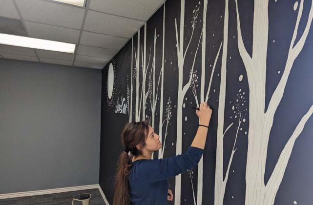 Library employee Daniela Carrillo paints a mural in the new teen area at the Dublin Public Library. The library has undergone a major transformation and is anticipated to reopen this Saturday. New murals are featured in both the teen area and the children’s area at the library. Paul Gaudette | Citizen staff photo
