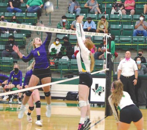 Dublin Lady Lion Callie Sears blocks an incoming hit from an Early Lady Longhorn at Friday’s home game. Sara Gann | Citizen staff photo
