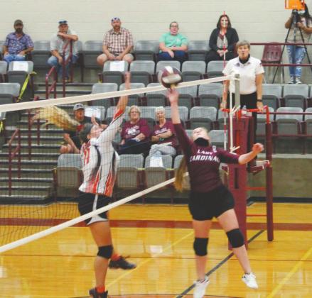 Lingleville Lady Cardinal Jordyn Hicks leaps to tip the ball in the home game against Gustine on Sept. 29. The Lingleville girls won the game in three sets, bringing their district record to 7-1. Sara Gann | Citizen staff photo