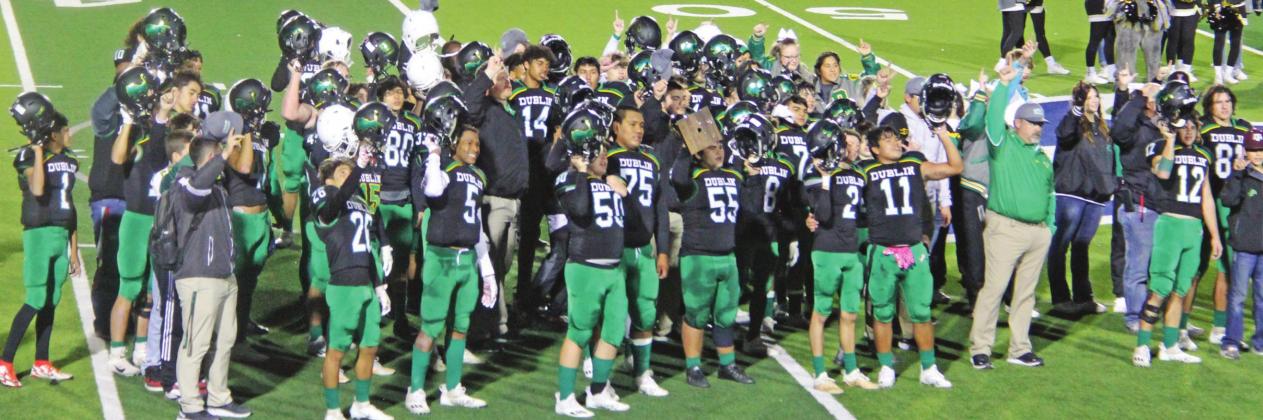 The Dublin Lions (above) raise up fingers during the school song moments after claiming the Area championship title for the first time in school history. Players Christian Ramirez and Cooper Pickett run to each other and shout in celebration. Paul Gaudette | Citizen staff photo