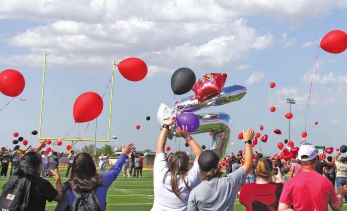 Balloons were released on the Bob and Norma Cervetto Field in honor of the 16th birthday of DHS student Eddie Hernandez. Hernandez was lost in a two-vehicle accident Thursday night on Highway 67. Paul Gaudette | Citizen staff photo