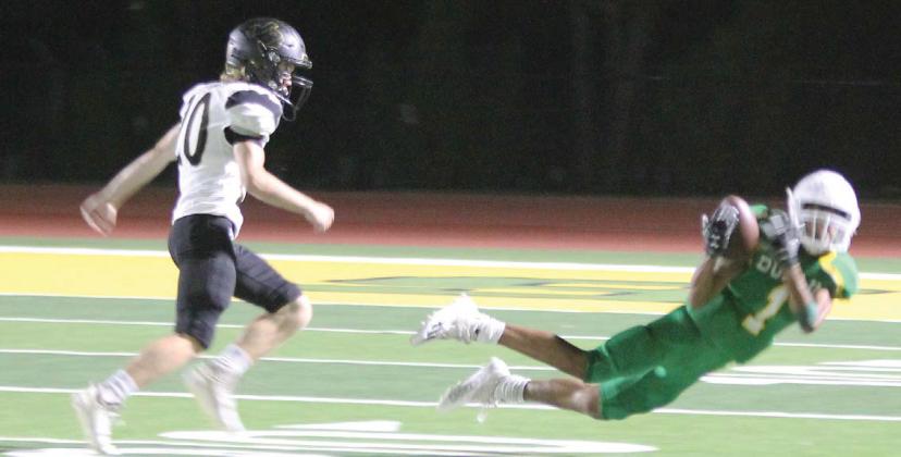 Above, Dublin Lion Kaden Gaitan leaps to catch a pass during Friday night’s home game while below, Sev Ruiz takes down a Brady Bulldog and the Dublin ISD band plays in full uniform for the first time this season. Paul Gaudette | Citizen staff photos