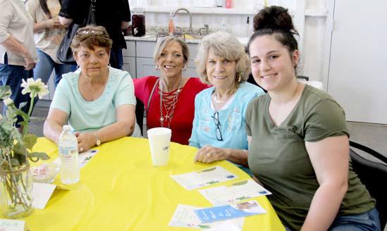 Left, volunteers and supporters of CWJC enjoy sharing time together. Above, Board President Elisa Tiscareno shares her thanks for all of the volunteers. Wyndi Veigel | Citizen staff photos