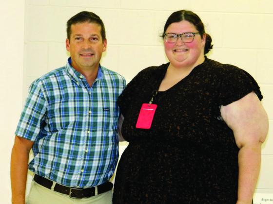 High School Staff Member of the Month Rebekah Yoho Presented by Secondary Assistant Principal Cedric Ivie.