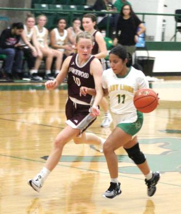 Dublin Lady Lion Adriana Rosalez drives the ball around Brownwood defense during their opening game of the Dublin Athletic Booster Club Tournament Thursday, Nov. 30. Paul Gaudette | Citizen staff photo