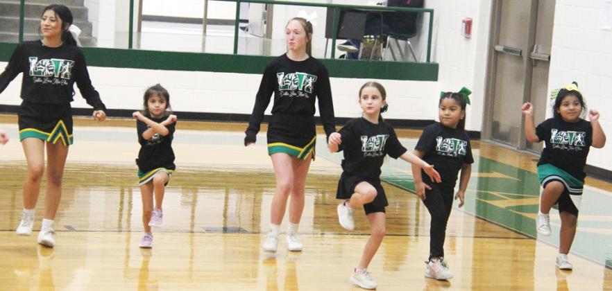 The Dublin Lion stands were packed Feb. 11 as the cheerleaders led some little ‘leaders in training’ through several routines while the gym filled with claps, chants and stomps in some high spirited routines. Paul Gaudette | Citizen staff photos