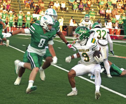 Dublin Lion Ruben Bustillos side steps to meet a Bangs defender in the Friday, Aug. 28 season opener. Paul Gaudette | Citizen staff photo