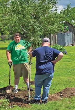 Dublin Citizen editor Paul Gaudette and friend not looking tired after planting a tree... Not at all. Citizen staff photo