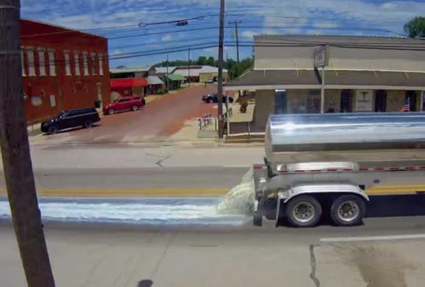 A milk truck accidentally sprays roadways Sunday, June 14 after a valve was not secured. The company is responsible for the cleanup. Courtesy photo