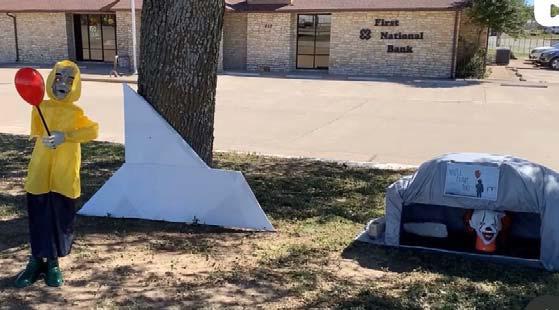 First National Bank cautions citizens against storm drains with their ‘IT’ written by Stephen King display. Pennywise, the terrifying clown, exclaims ‘you’ll float too’ in the display along with Georgie and a paper boat. Paul Gaudette | Citizen staff photo