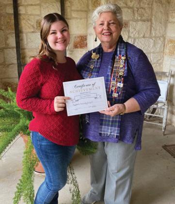 Hannah Miller receives a certificate for completing a project as a member of the Bosque River Chapter of Children of the Republic of Texas. Presenting the certificate is D’Amico. Submitted photo