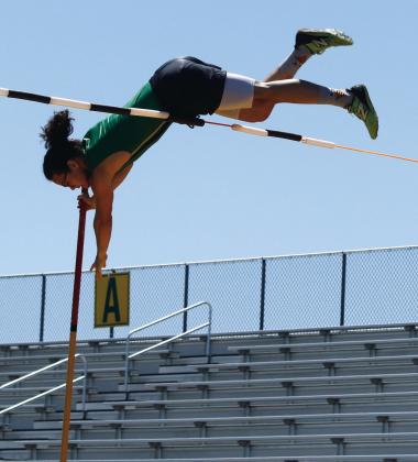 Travis Spharler vaults up in runthroughs before claiming first in the varsity boys pole vault competition April 8 at Cervetto Field. Paul Gaudette | Citizen staff photo
