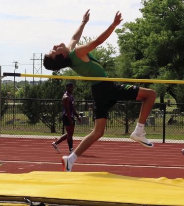 Alex Teten pops up to take first in the varsity boys high jump event at the district track meet April 8 in Dublin. Paul Gaudette | Citizen staff photo
