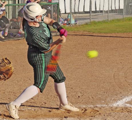 Lady Lion Cassidy Adair swings for a hit in a recent game on the Dublin diamond. Paul Gaudette | Citizen staff photo