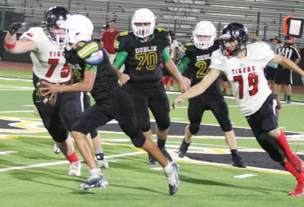 Paul Gaudette | Citizen staff photo Dublin JV Green Lion Ayden Vargas advances the ball through Anson Tiger defense during Thursday’s home game. It ended in a 43-19 loss for the home team.