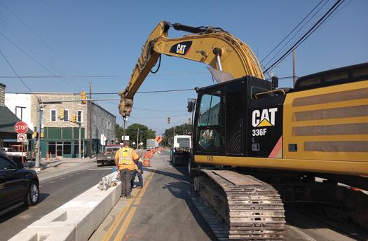 Construction crews place concrete beams along Patrick Street to aid in work at the Patrick Street/ Blackjack intersection. Large vehicles should find alternate routes. Ben Pate | Submitted Photo